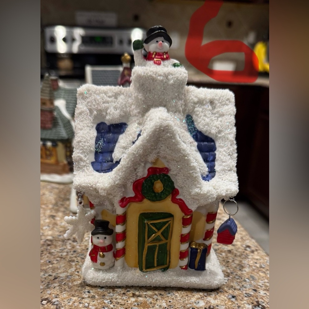 Several Christmas village pieces